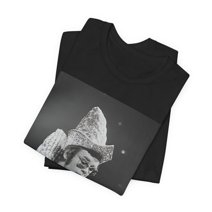 A black graphic t-shirt featuring a 70s pop aesthetic graphic of Elton John.