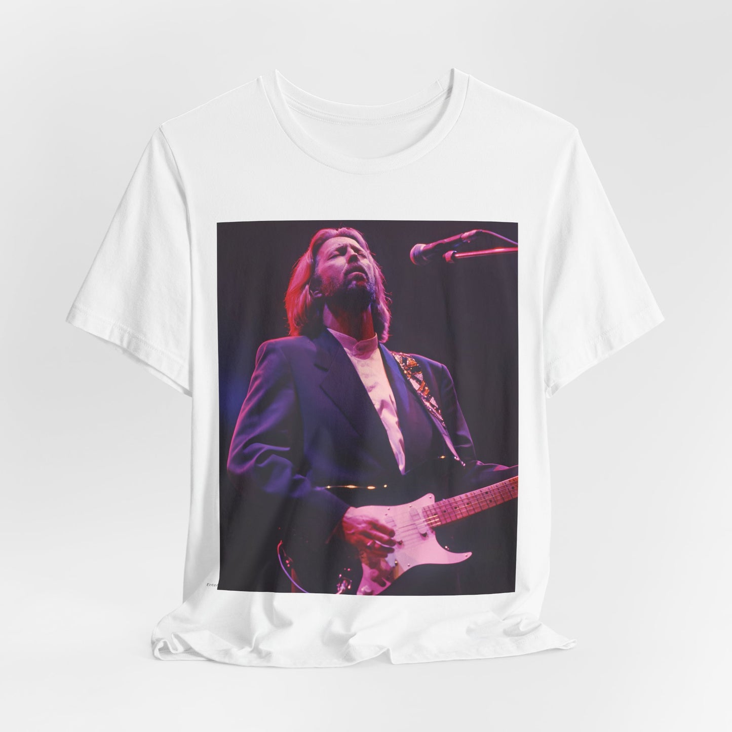 A black graphic t-shirt featuring a vintage graphic of Eric Clapton as a blues rock icon.