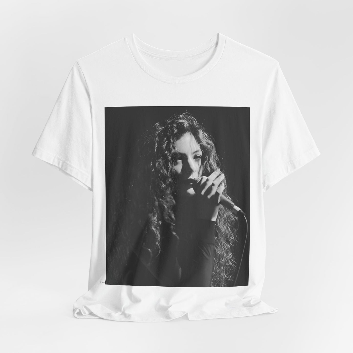 A black graphic t-shirt featuring a graphic or photo of Lorde performing live.