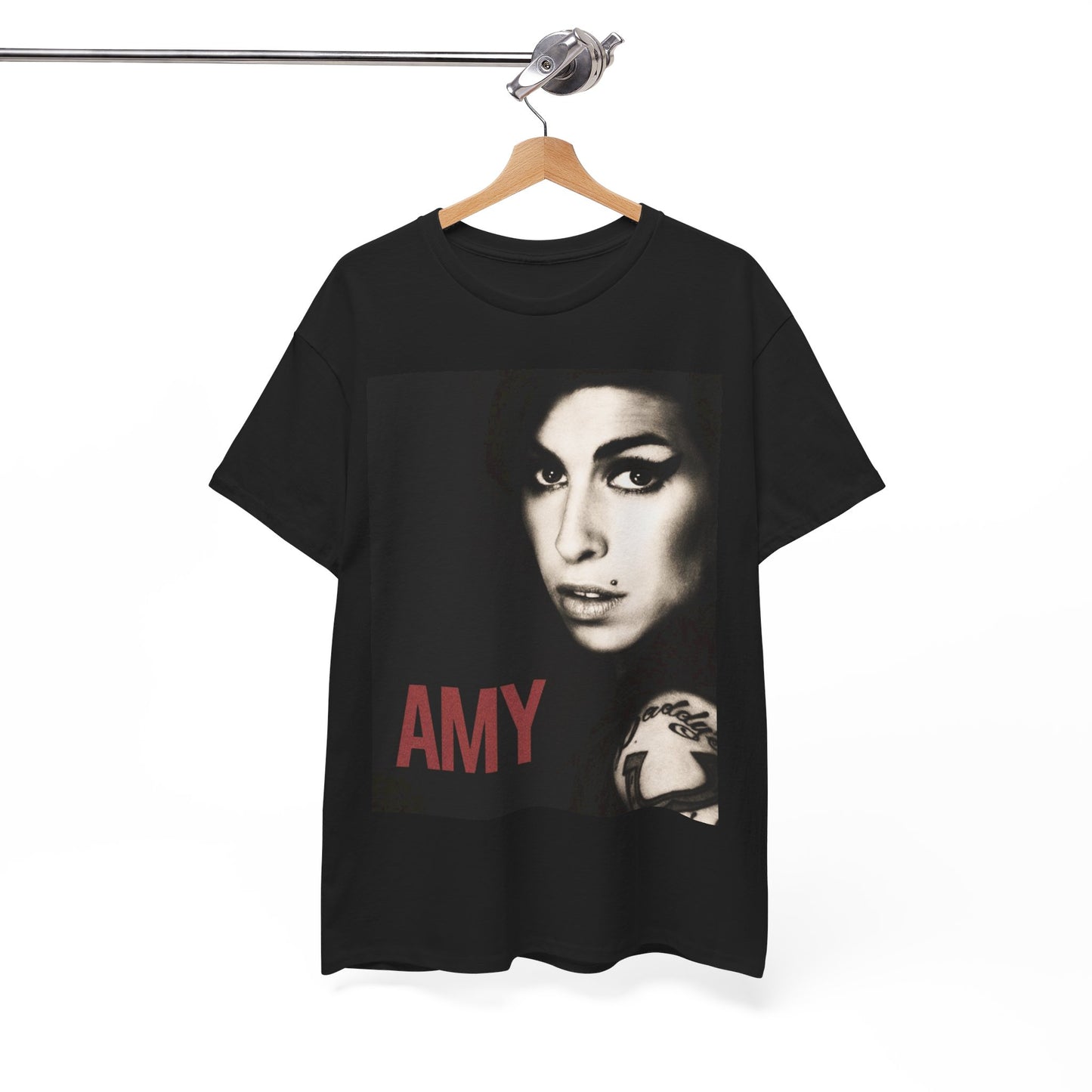 A black graphic t-shirt featuring a stylized graphic of Amy Winehouse, designed to represent her enduring legacy, possibly with her name or iconic elements.