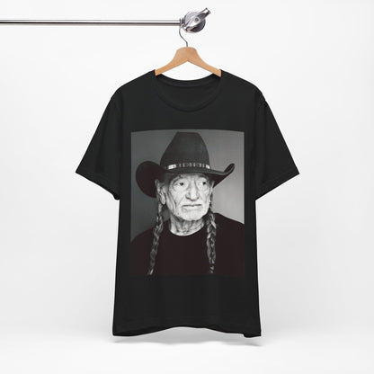 A black graphic t-shirt featuring a graphic of Willie Nelson with his iconic guitar 'Trigger'.