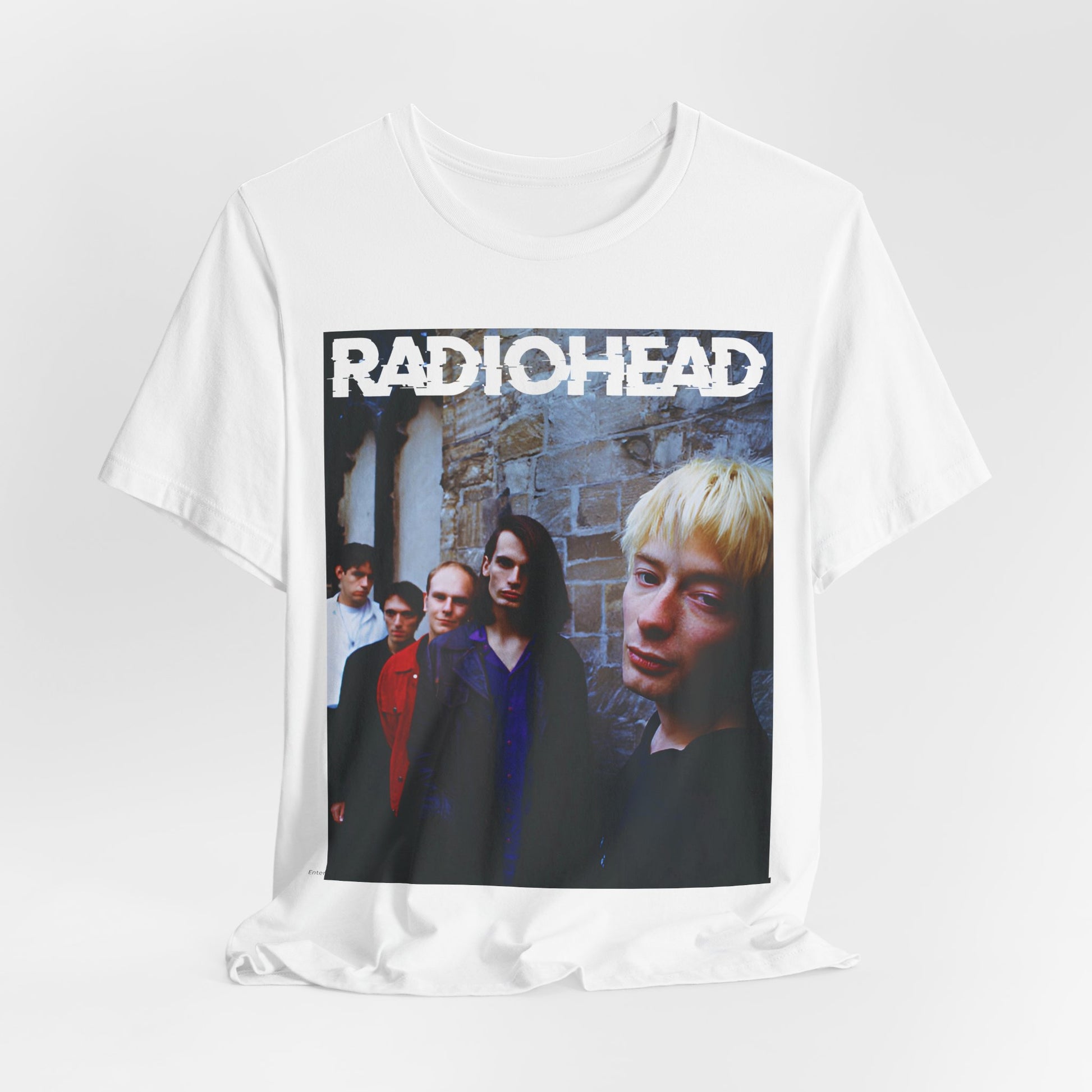 A black graphic t-shirt featuring a 90s graphic related to Radiohead's 'Karma Police' song or era.