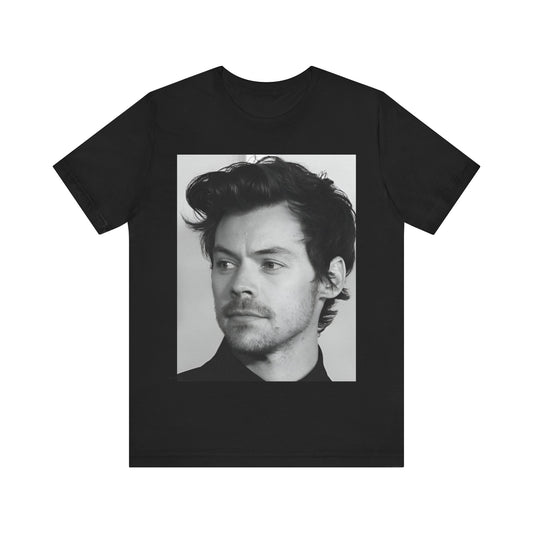 A black graphic t-shirt featuring a black and white, monochrome graphic or photo of Harry Styles.