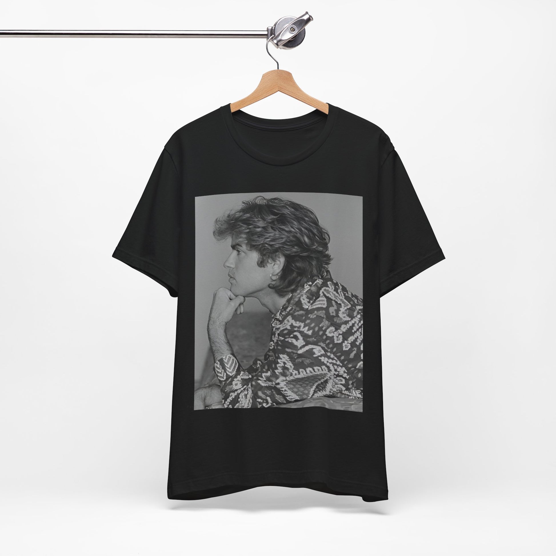 A black graphic t-shirt featuring a graphic of George Michael from his 80s Wham! era.