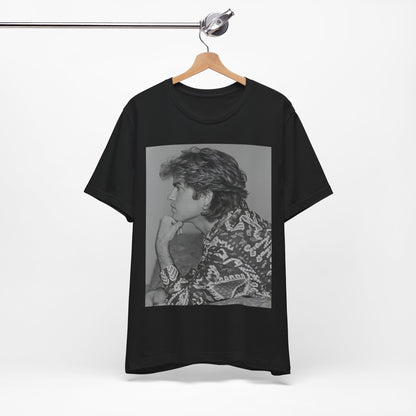 A black graphic t-shirt featuring a graphic of George Michael from his 80s Wham! era.