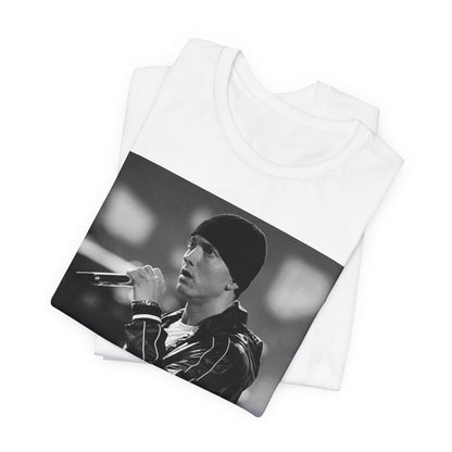 A black graphic t-shirt featuring a classic 90s graphic of Eminem as a 'Rap God'.