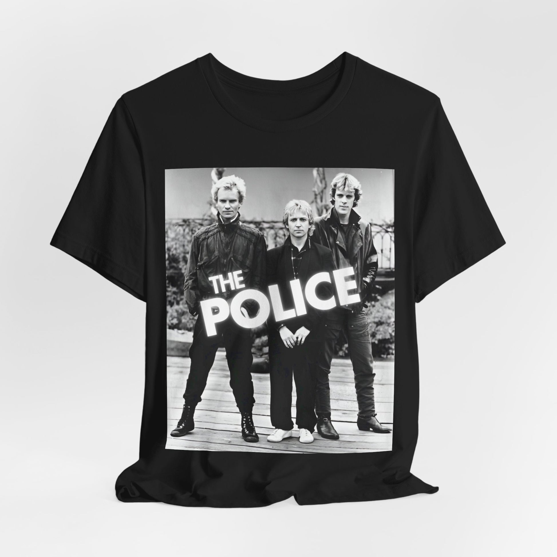 A black graphic t-shirt featuring an 80s pop rock aesthetic black and white graphic of The Police.