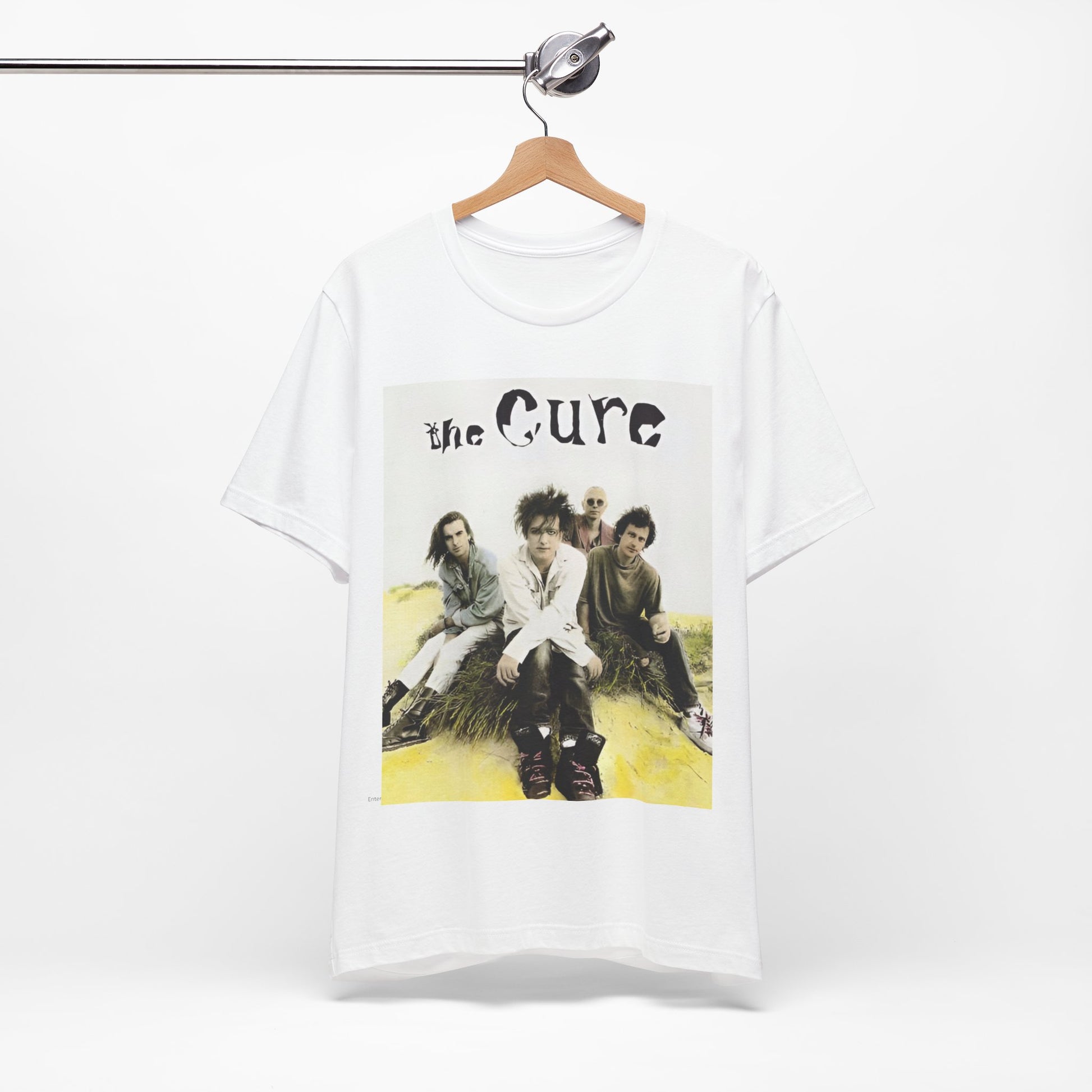 A black graphic t-shirt featuring a graphic of The Cure as post-punk pioneers.