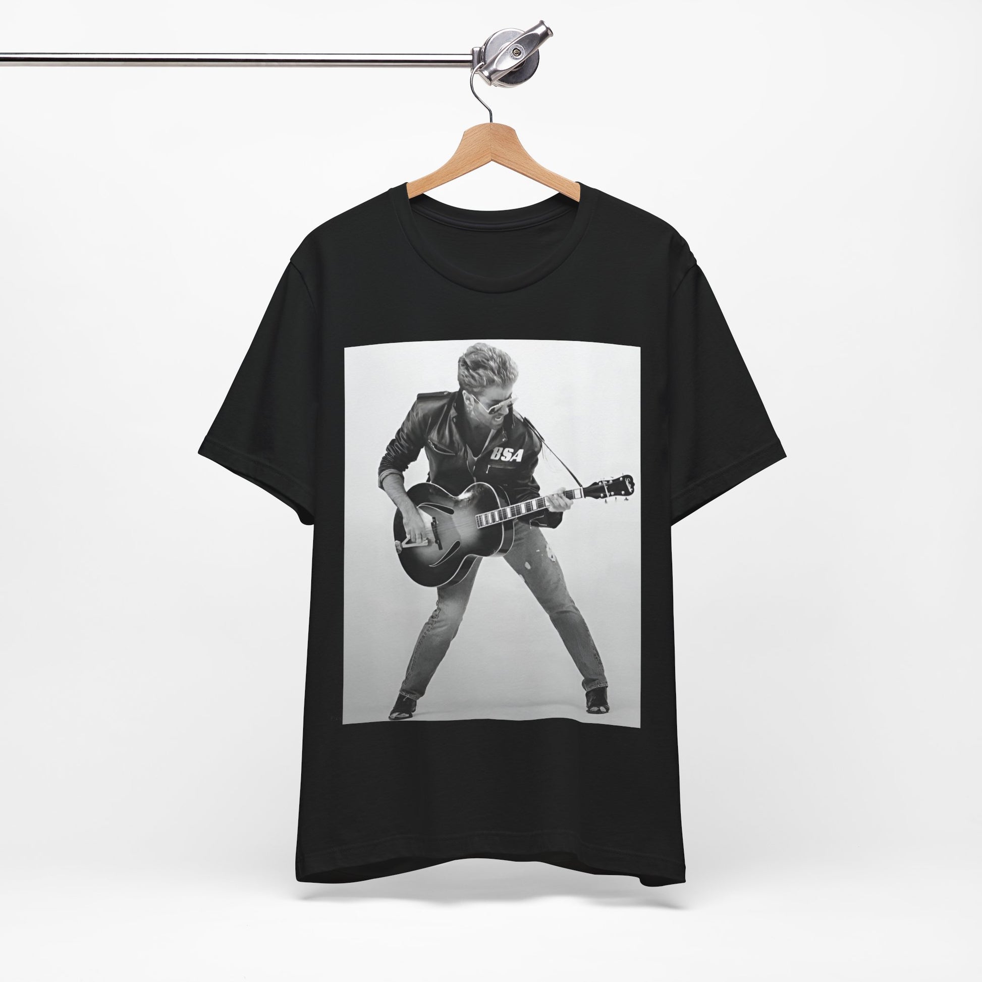 A black graphic t-shirt featuring a graphic of George Michael with a guitar.