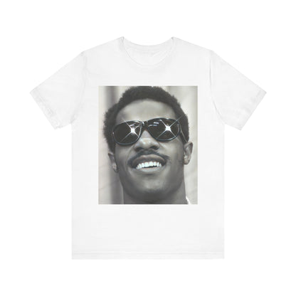 A black graphic t-shirt featuring a 70s funk aesthetic black and white graphic or photo of Stevie Wonder.