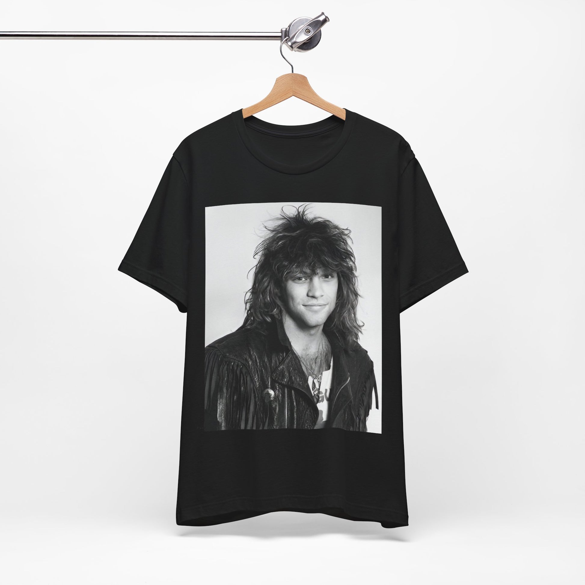 A black graphic t-shirt featuring a black and white photo of Bon Jovi from a 90s tour, performing on stage.
