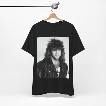 A black graphic t-shirt featuring a black and white photo of Bon Jovi from a 90s tour, performing on stage.