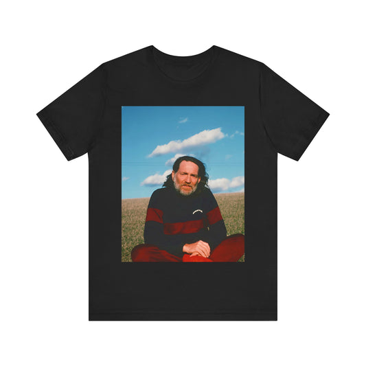 A black graphic t-shirt featuring a classic outlaw country graphic of Willie Nelson.