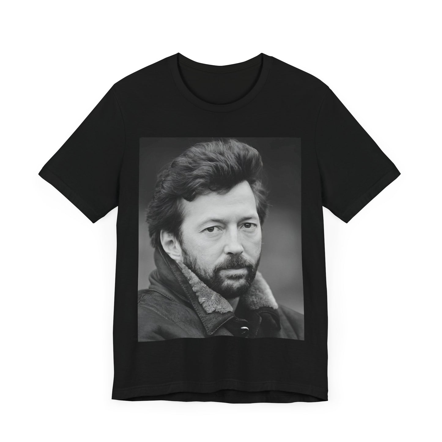 A black graphic t-shirt featuring a 70s rock aesthetic graphic of Eric Clapton.