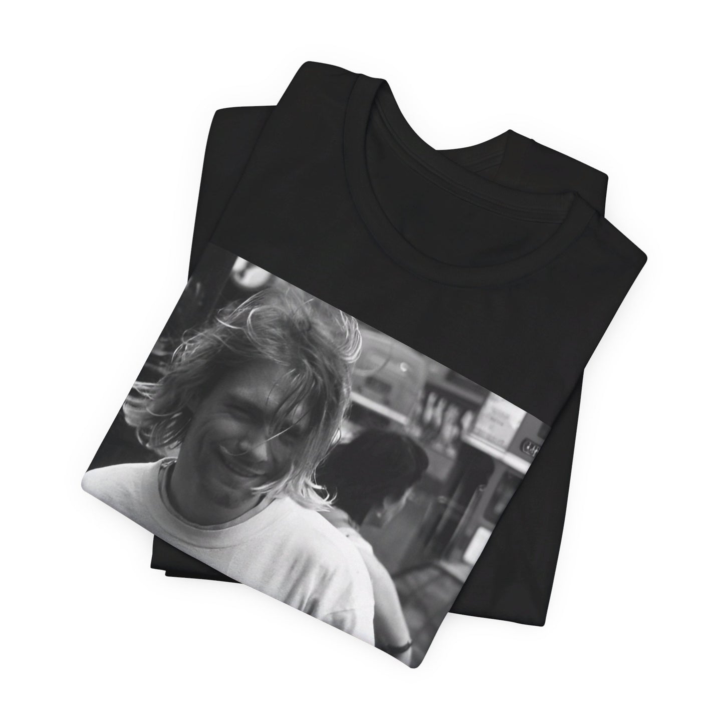 A black graphic t-shirt featuring a vintage rock legends graphic of Nirvana.