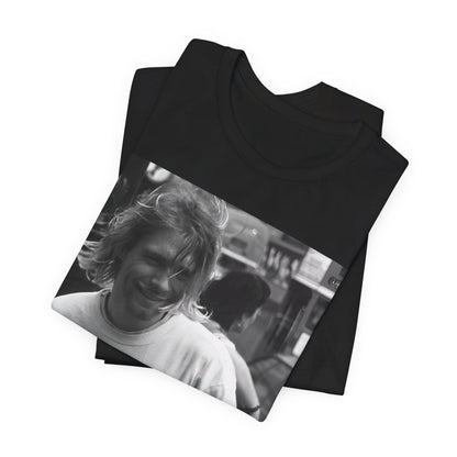 A black graphic t-shirt featuring a vintage rock legends graphic of Nirvana.