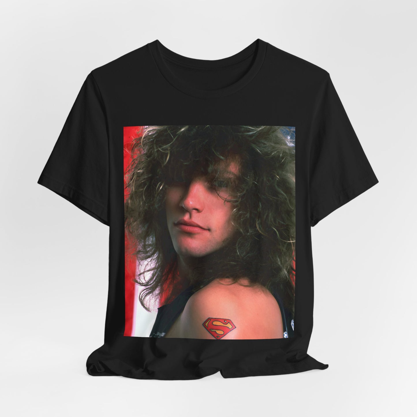 A black graphic t-shirt featuring a graphic of Bon Jovi, possibly with a Superman logo or a tattoo-inspired design.