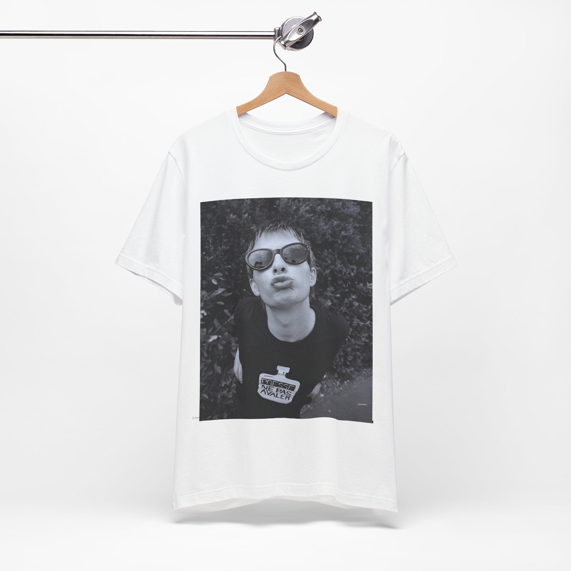 A black graphic t-shirt featuring a retro 90s graphic of Thom Yorke from Radiohead.
