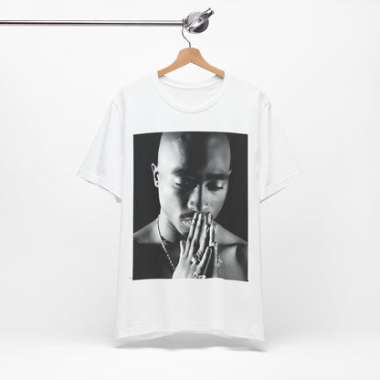 A black graphic t-shirt featuring a black and white streetwear rebel graphic of Tupac.