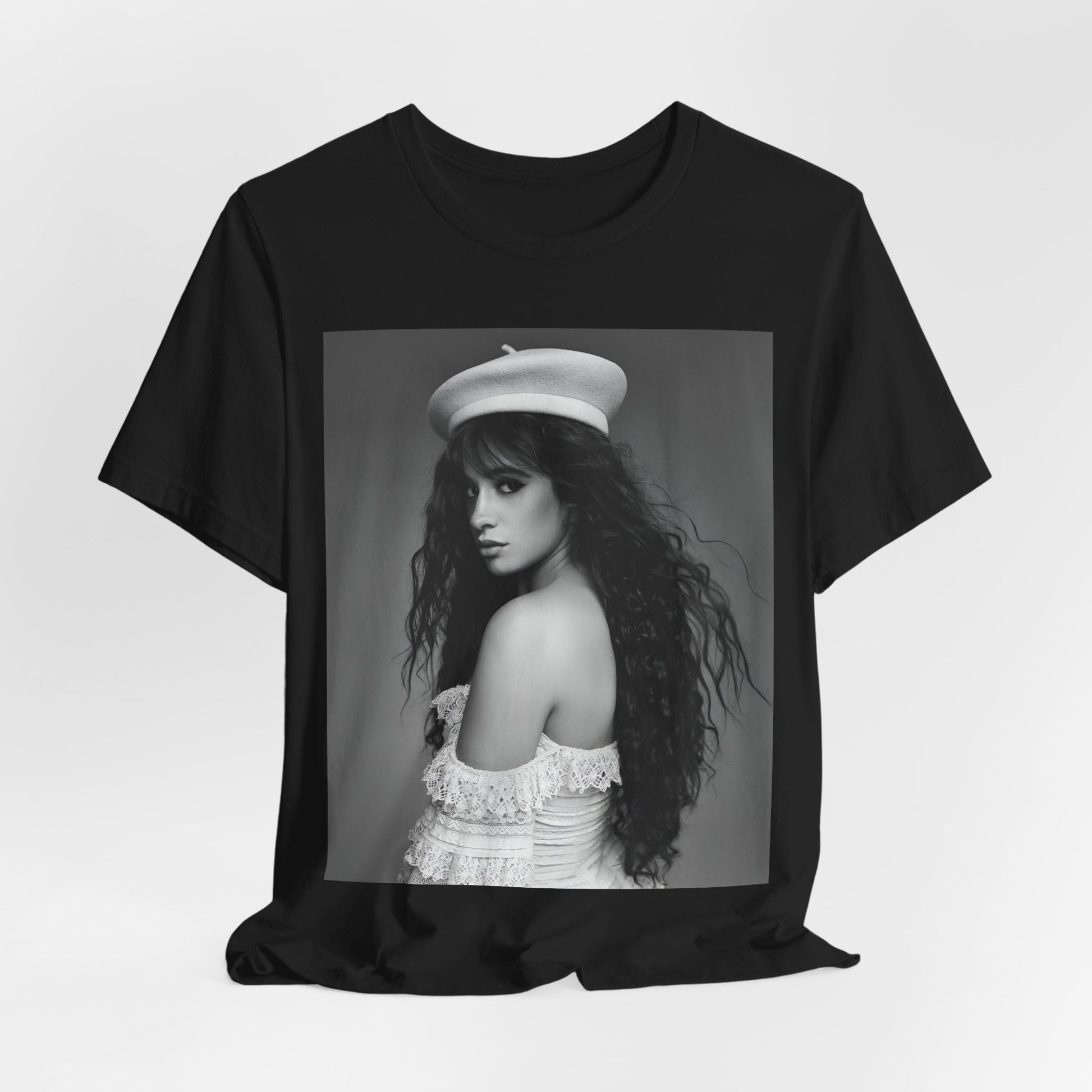 A black graphic t-shirt featuring a black and white graphic of Camila Cabello as a fierce Latina pop star.