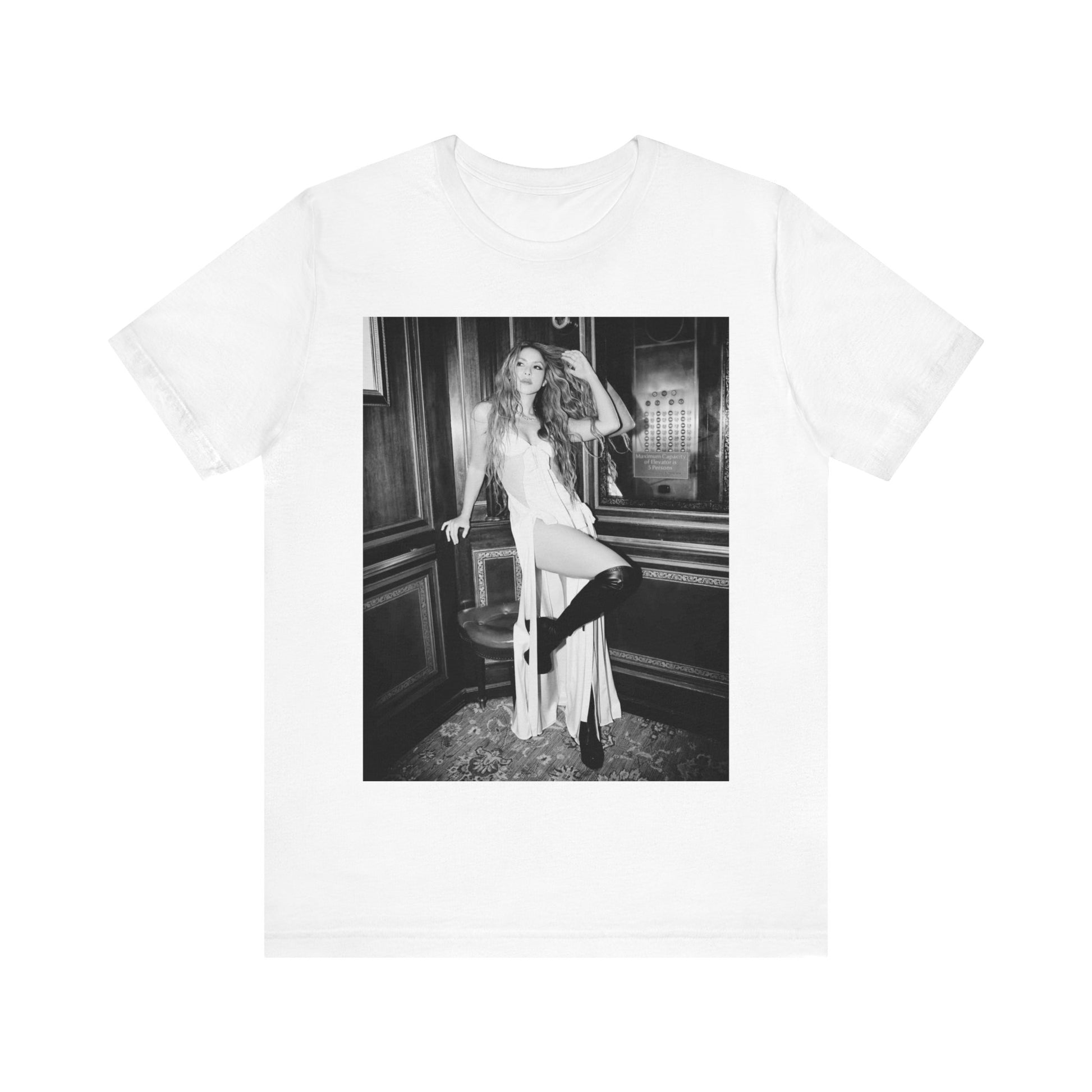 A black graphic t-shirt featuring a retro black and white monochrome graphic or photo of Shakira.