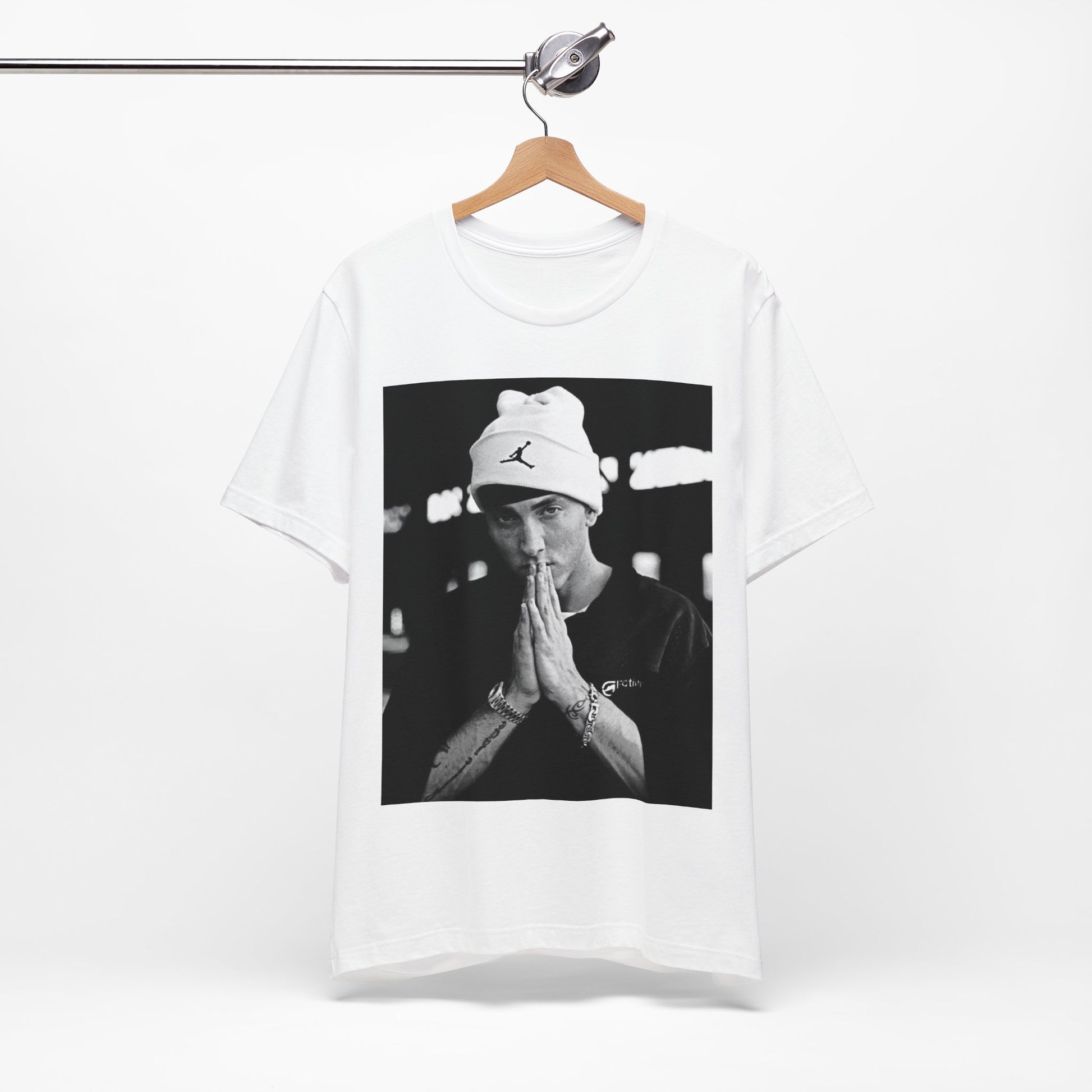 A black graphic t-shirt featuring a black and white portrait photo of Eminem.