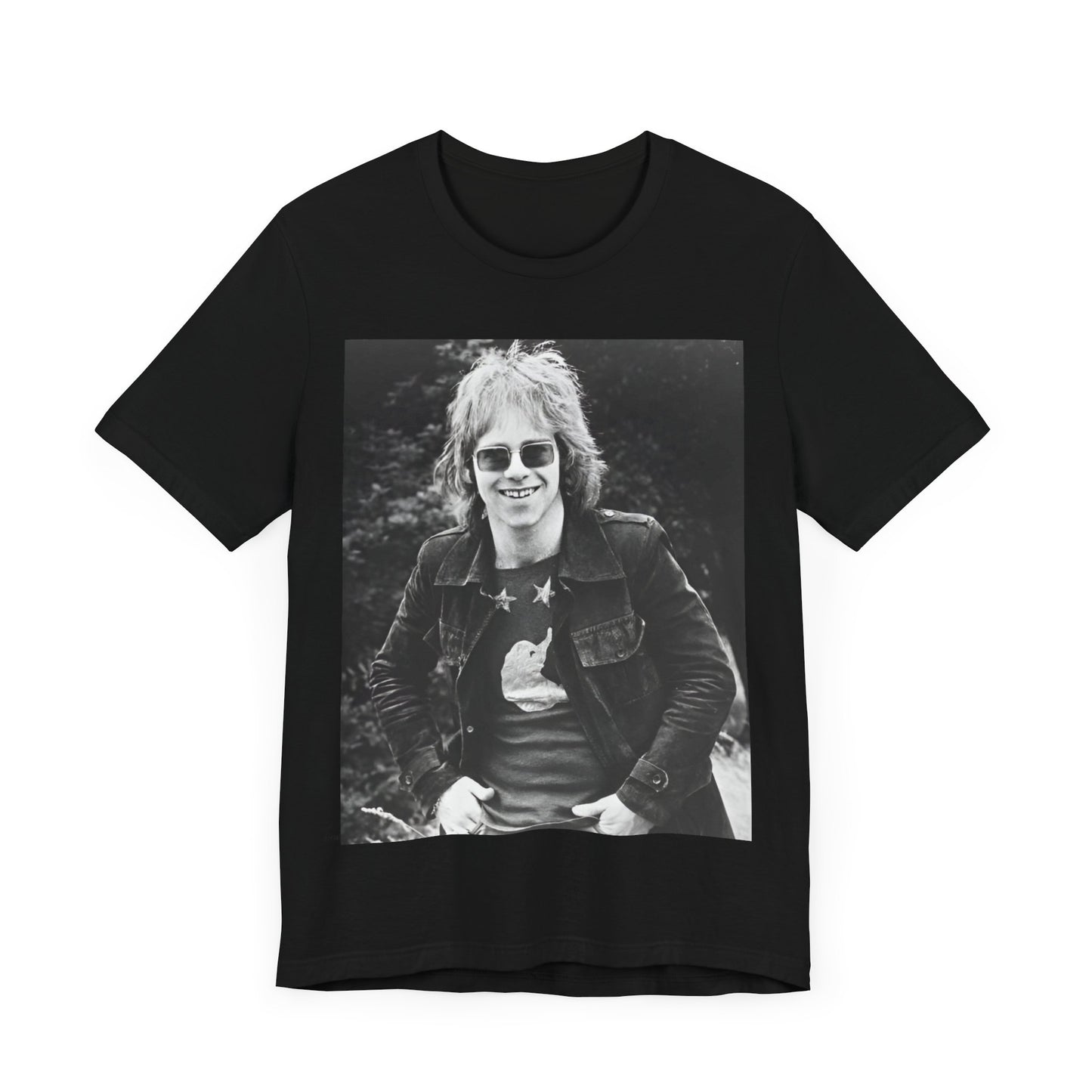 A black graphic t-shirt featuring a 70s black and white monochrome graphic or photo of Elton John.