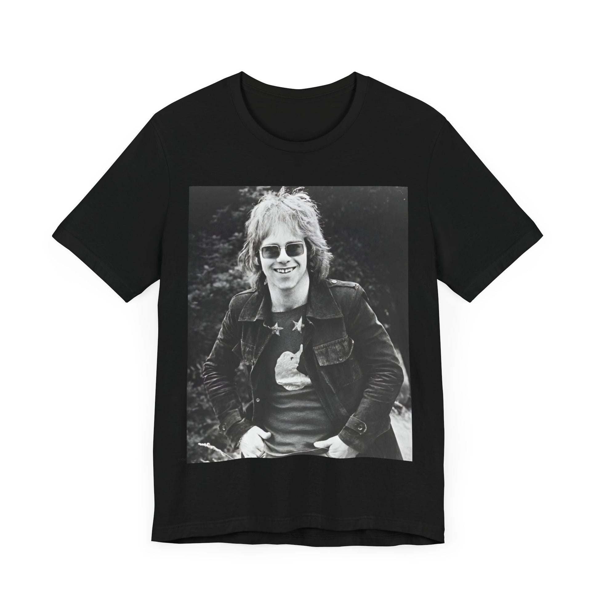A black graphic t-shirt featuring a 70s black and white monochrome graphic or photo of Elton John.