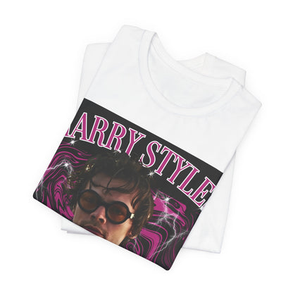 A black graphic t-shirt featuring a bootleg-style pop graphic of Harry Styles.