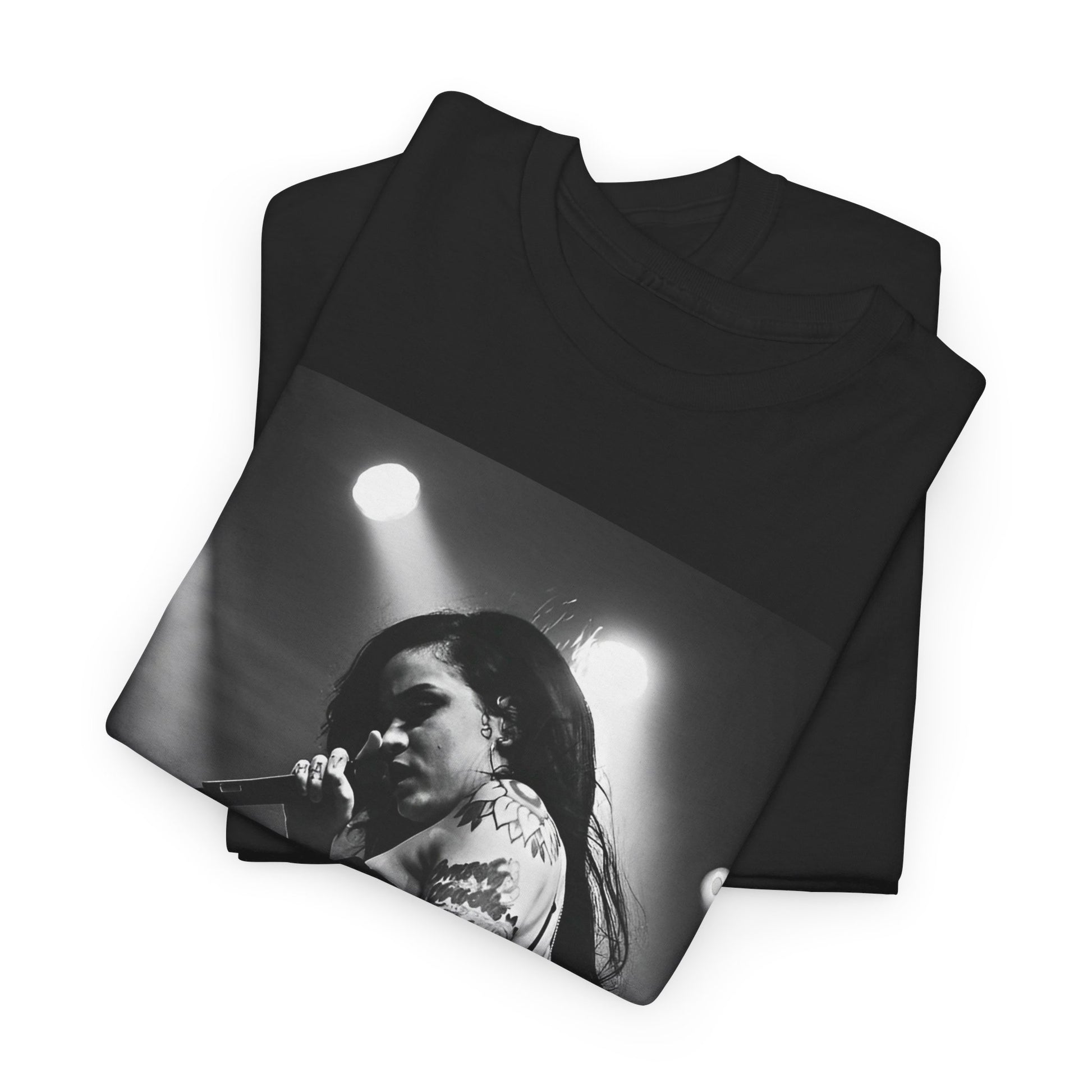 A black graphic t-shirt featuring a glamorous graphic or photo of Kehlani performing on stage.