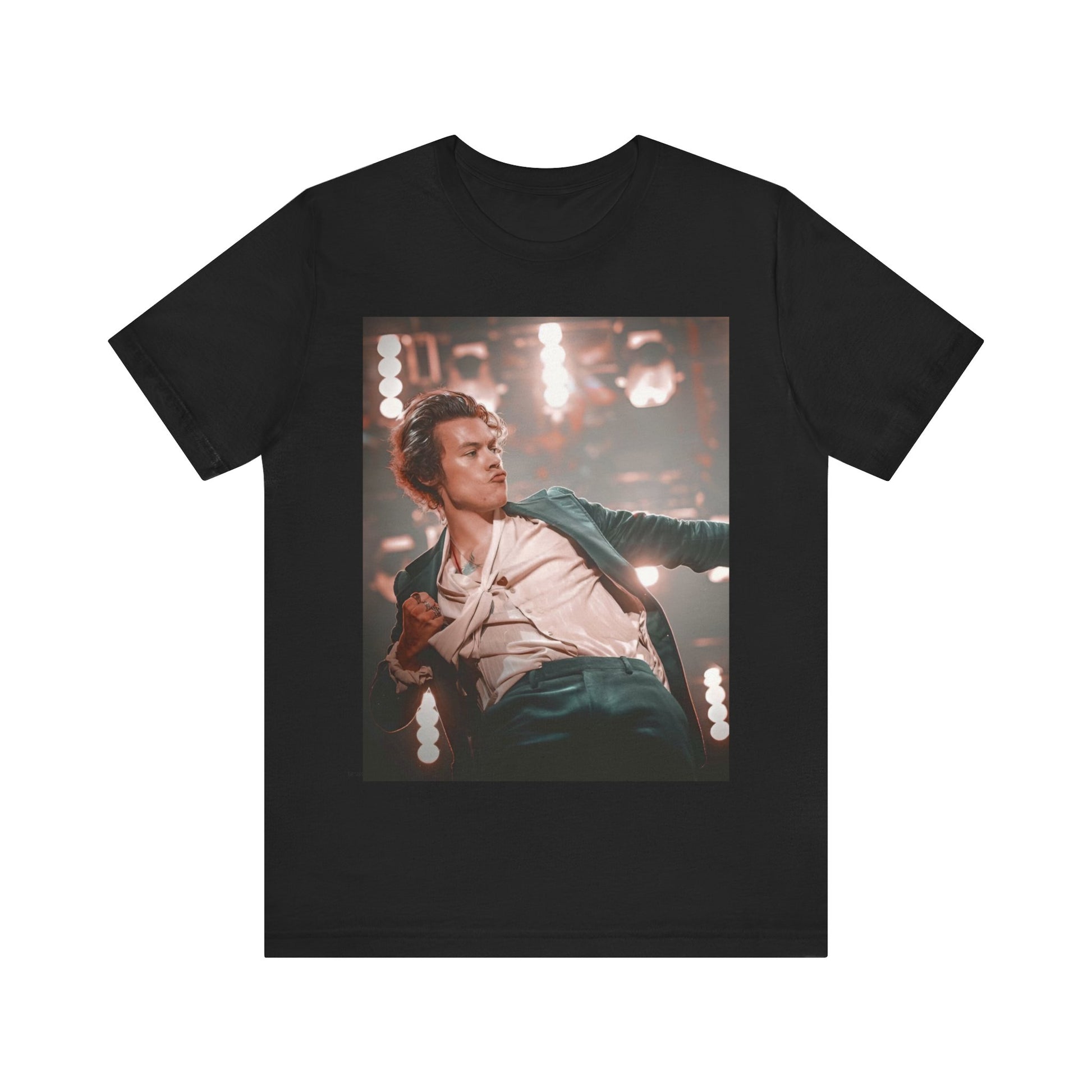 A black graphic t-shirt featuring a graphic or photo of Harry Styles performing live on concert tour.