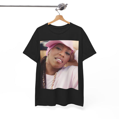 A black graphic t-shirt featuring a 90s rap graphic of Missy Elliott from her early days, emphasizing a raw style.