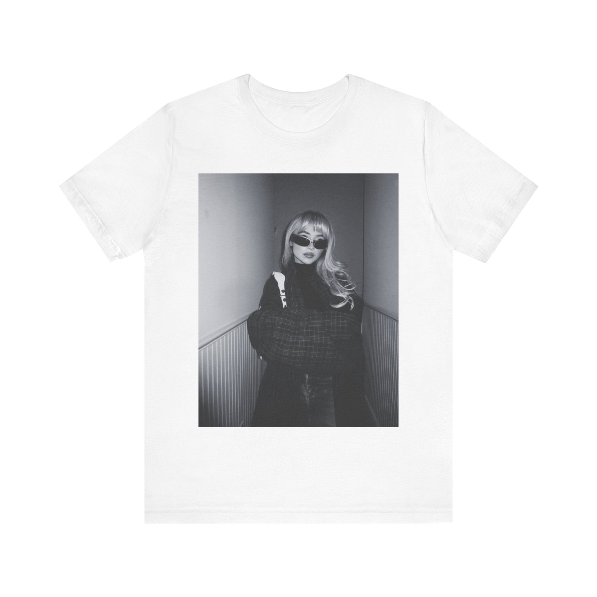 A black graphic t-shirt featuring a black and white glam pop diva graphic of Sabrina Carpenter.