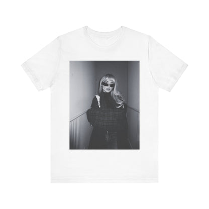 A black graphic t-shirt featuring a black and white glam pop diva graphic of Sabrina Carpenter.