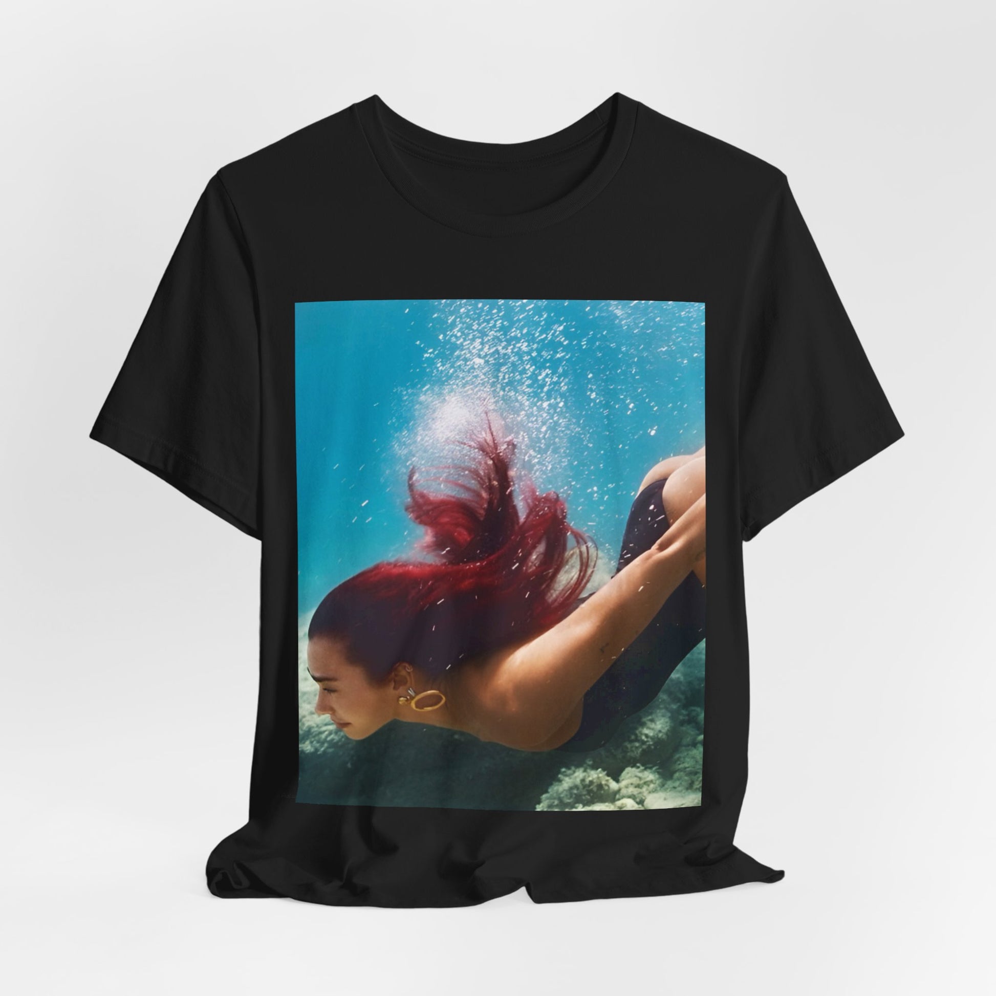 A black graphic t-shirt featuring a graphic related to Dua Lipa's 'Radical Optimism' album.