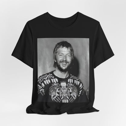 A black graphic t-shirt featuring a 70s photo portrait of Eric Clapton.