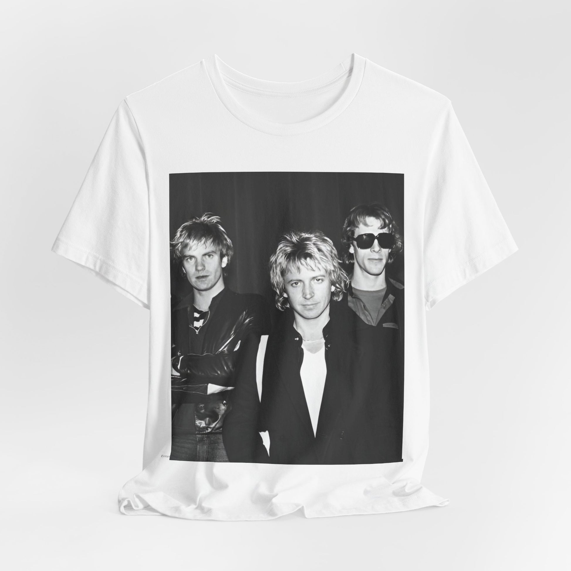 A black graphic t-shirt featuring a black and white, monochrome graphic or photo of The Police.