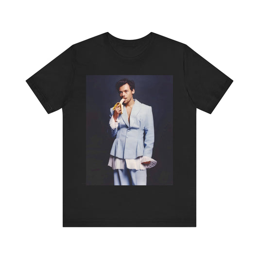 A black graphic t-shirt featuring a graphic related to Harry Styles and his One Direction legacy.