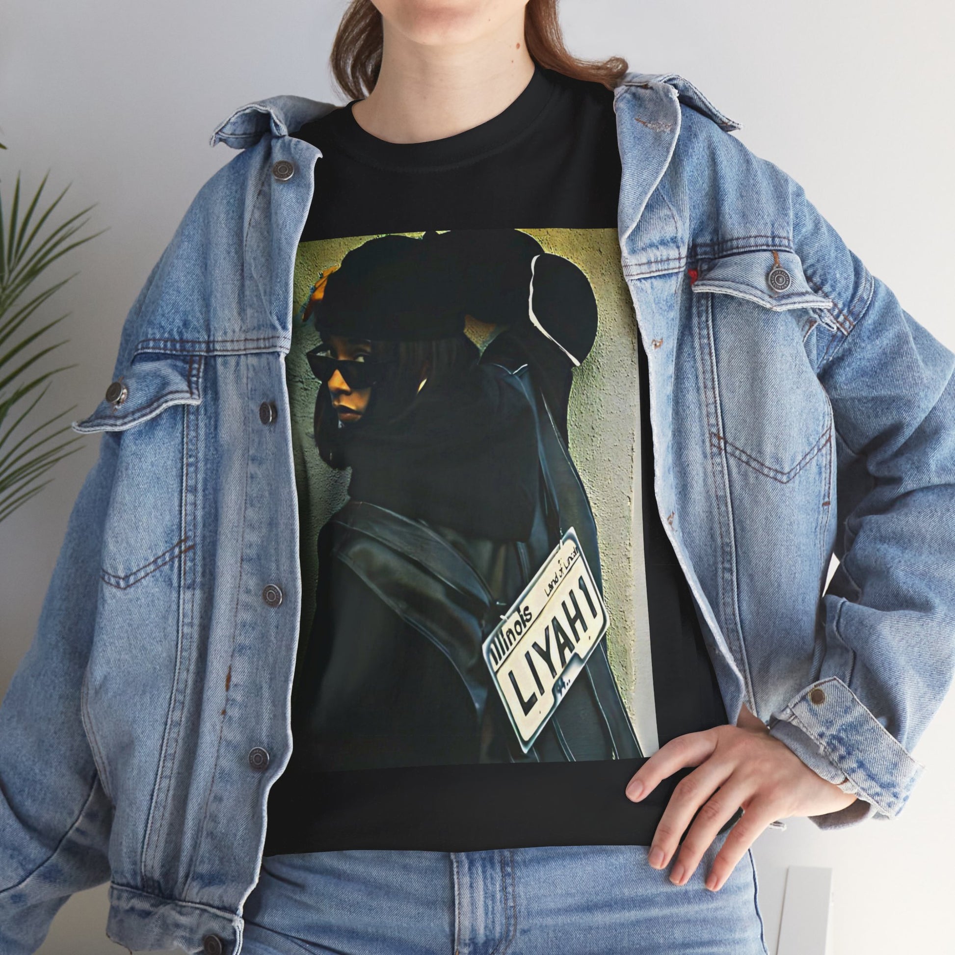 A black graphic t-shirt featuring a graphic of Aaliyah as the queen of urban rap legacy.