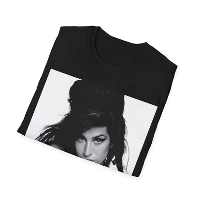 A black graphic t-shirt featuring a black and white portrait of Amy Winehouse, showing her with her signature beehive and soulful expression.