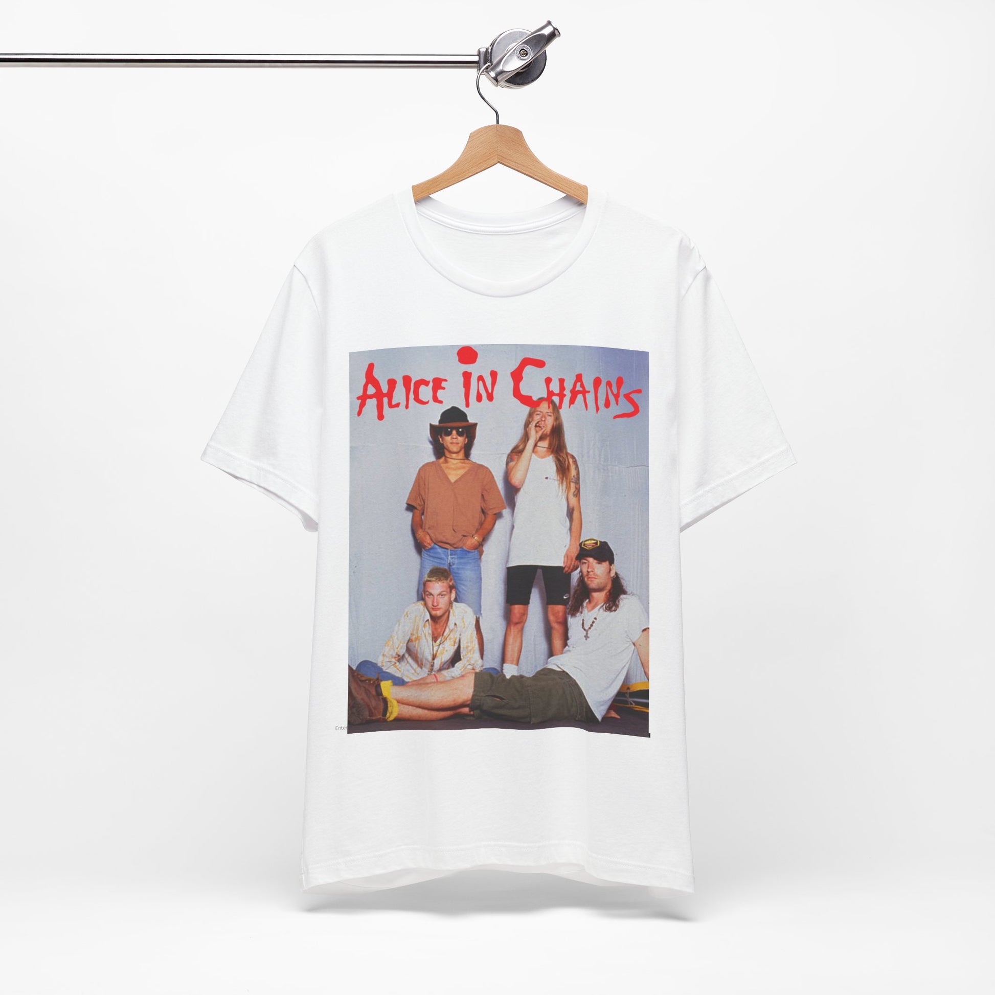 A black graphic t-shirt featuring a band graphic of Alice In Chains from 1990, capturing their early grunge aesthetic.