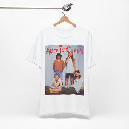A black graphic t-shirt featuring a band graphic of Alice In Chains from 1990, capturing their early grunge aesthetic.