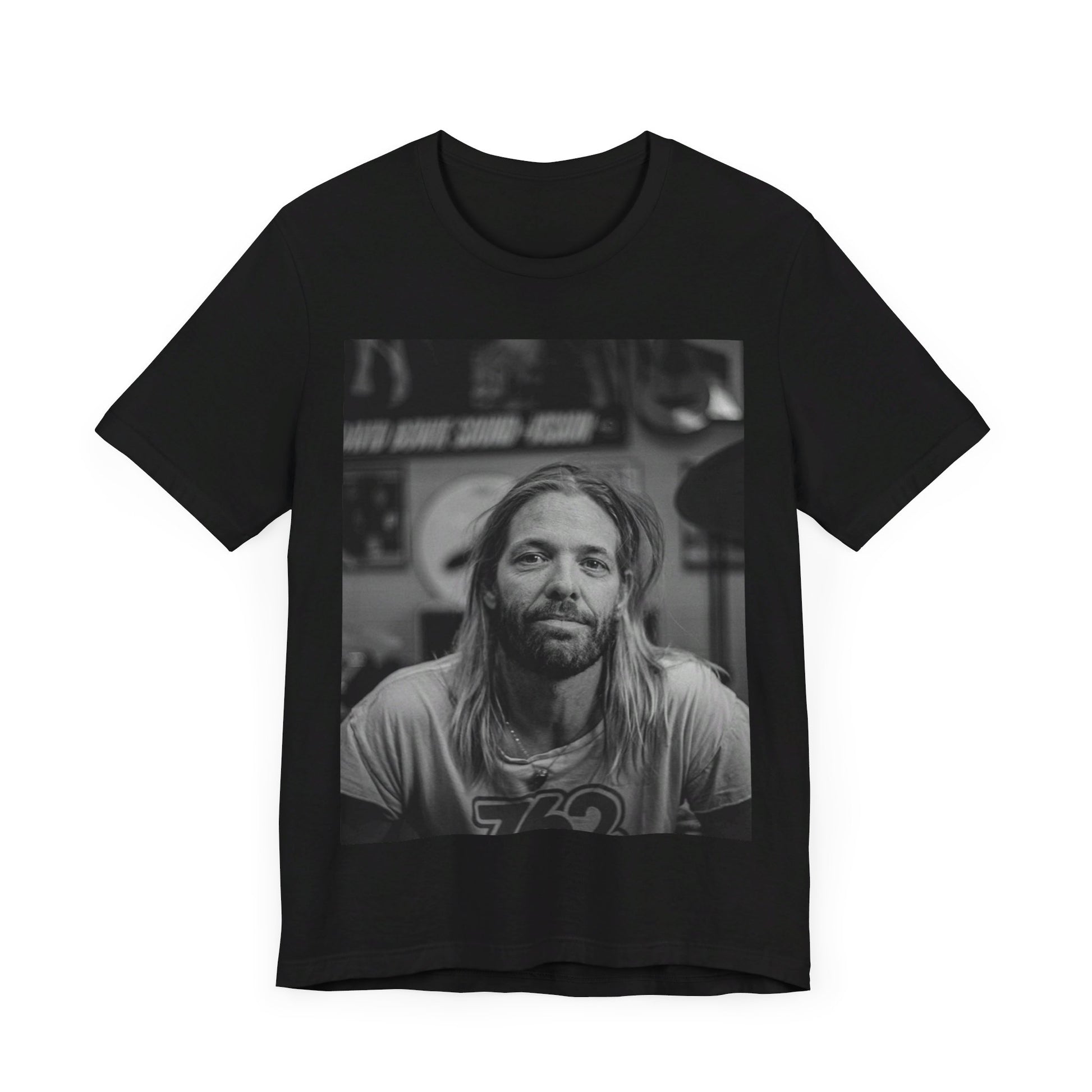 A black graphic t-shirt featuring a tribute graphic for Taylor Hawkins of Foo Fighters.