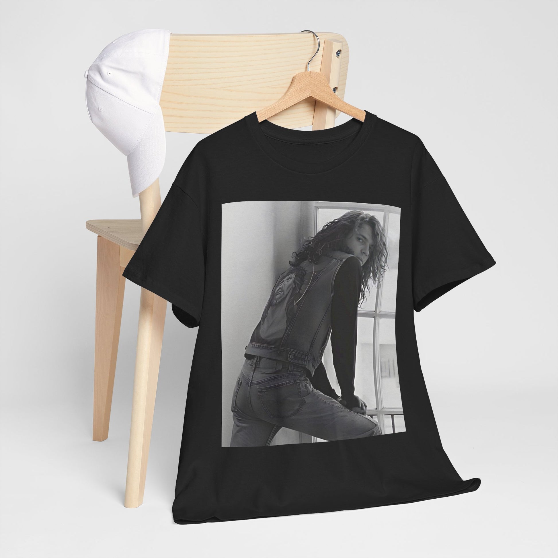 A black graphic t-shirt featuring a 90s black and white photo portrait of Michael Hutchence from INXS.