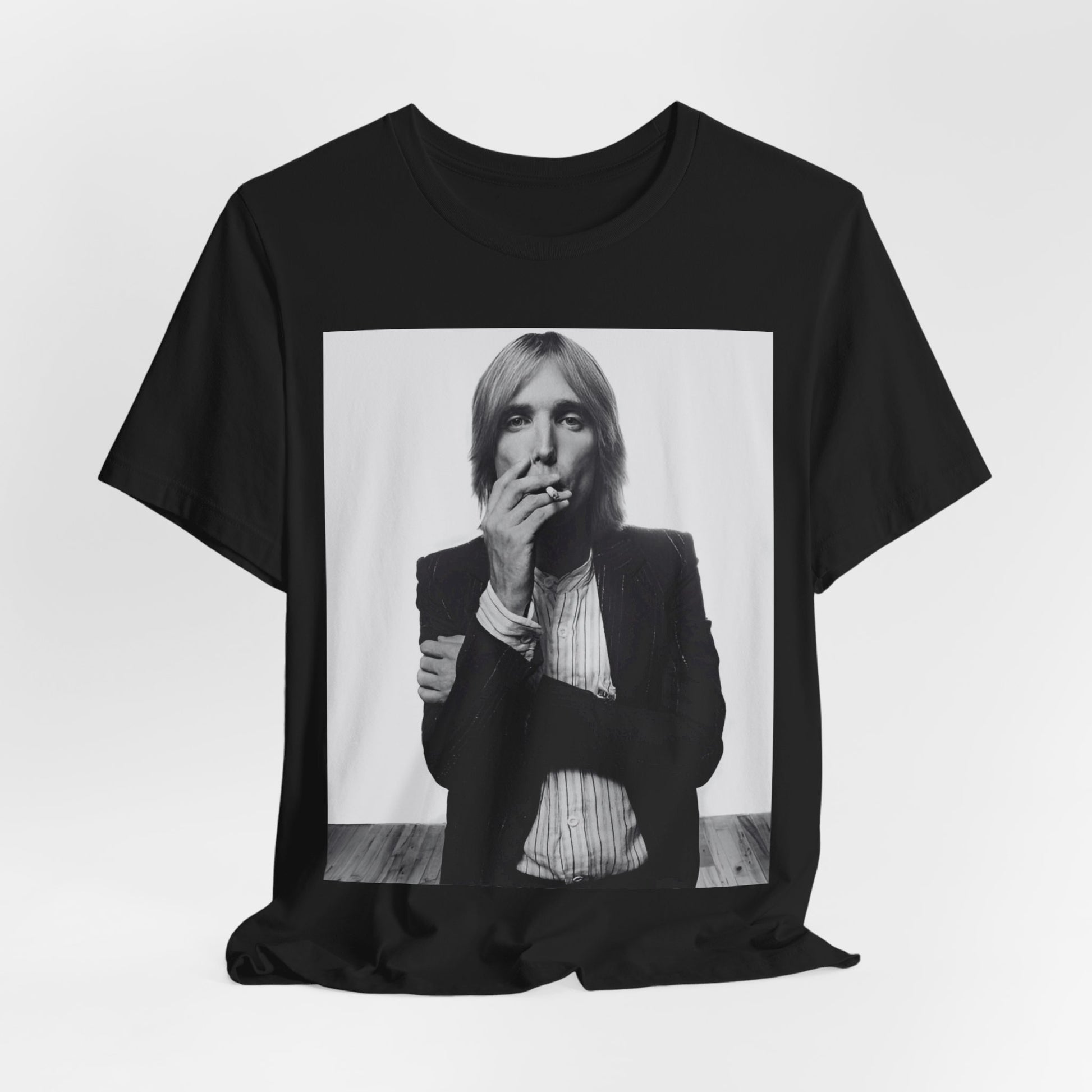 A black graphic t-shirt featuring a black and white graphic or photo of Tom Petty as a Southern rock icon.