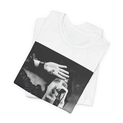 A black graphic t-shirt featuring a black and white portrait photo of The Strokes band.