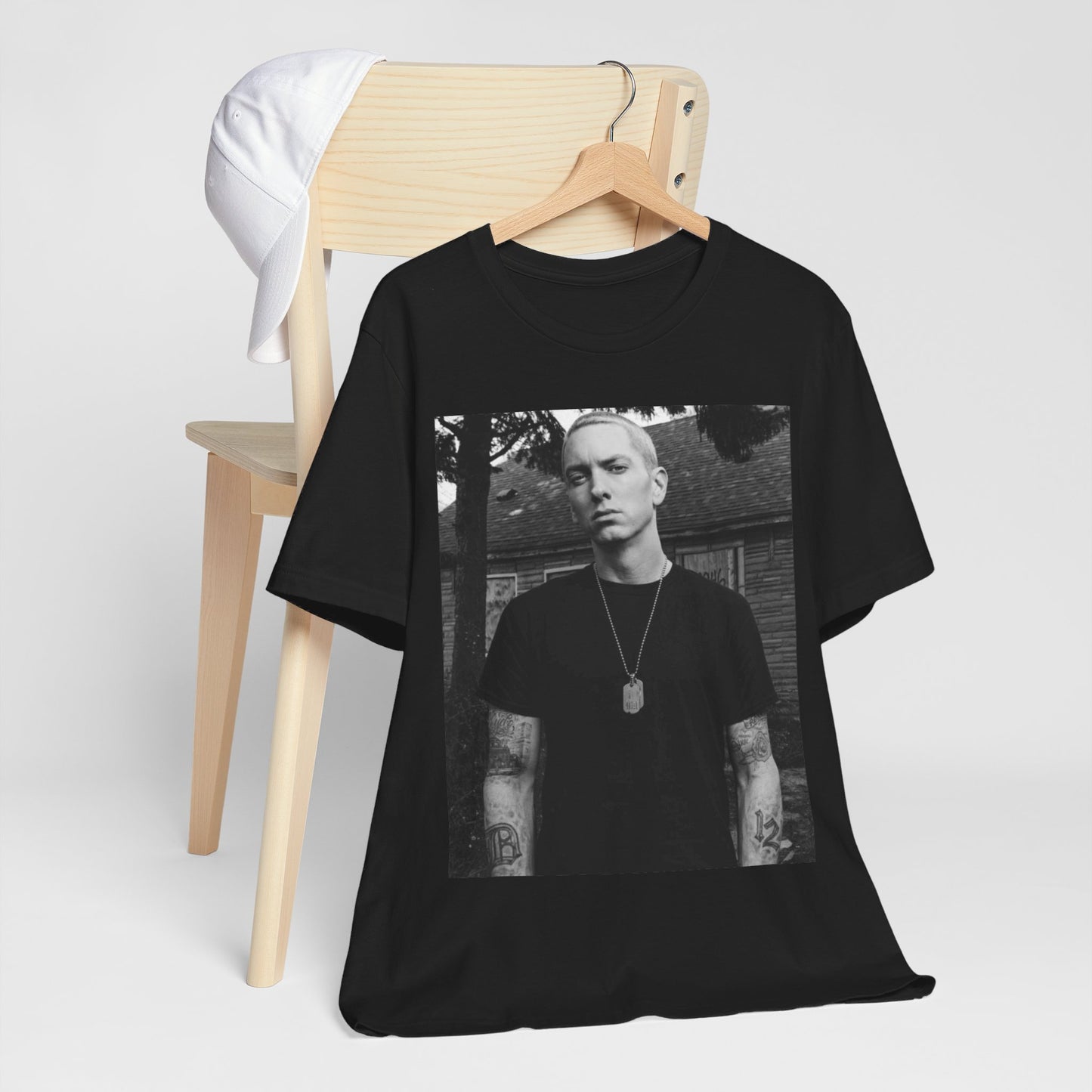 A black graphic t-shirt featuring a black and white graphic of Eminem as Slim Shady.