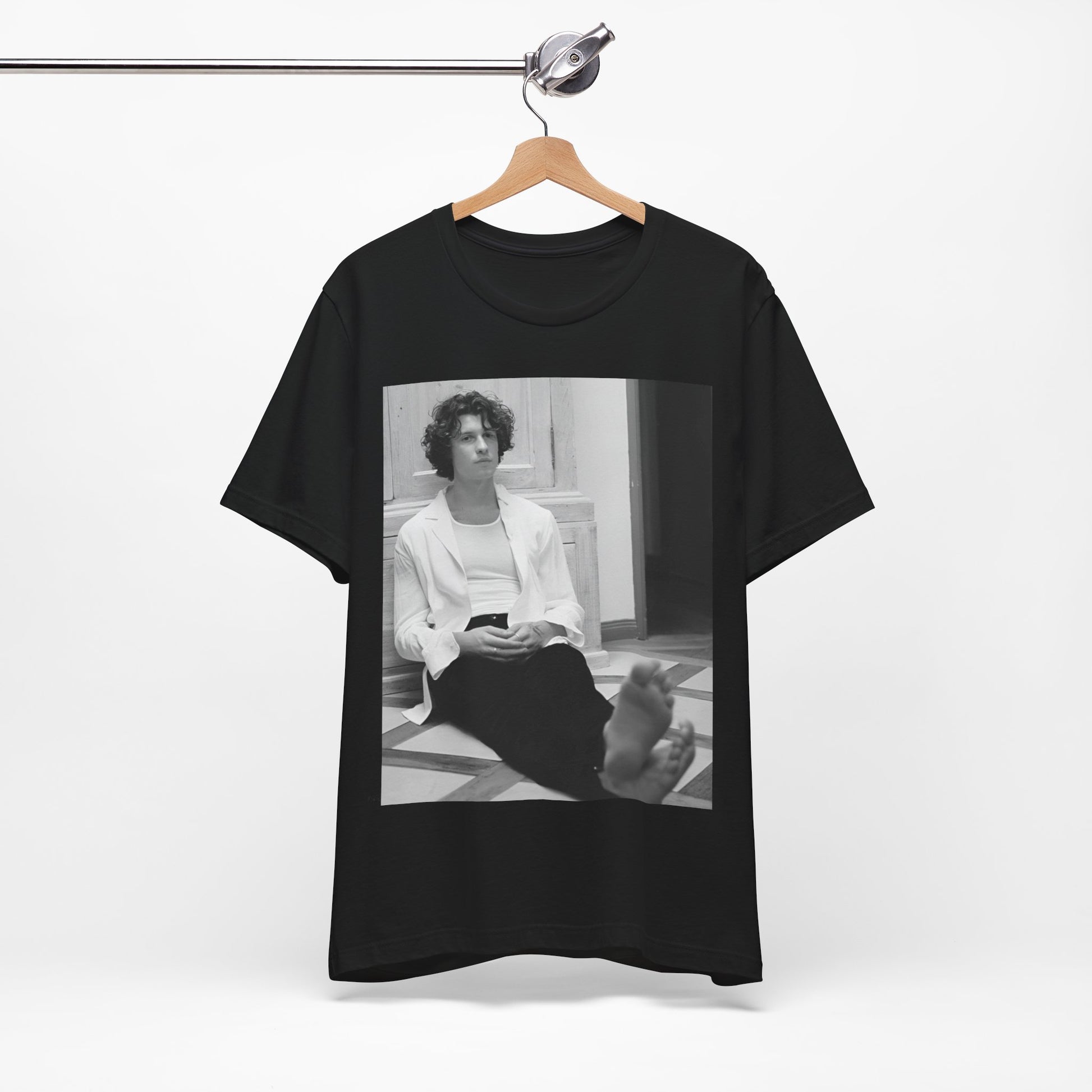 A black graphic t-shirt featuring a vintage casual style graphic of Shawn Mendes.