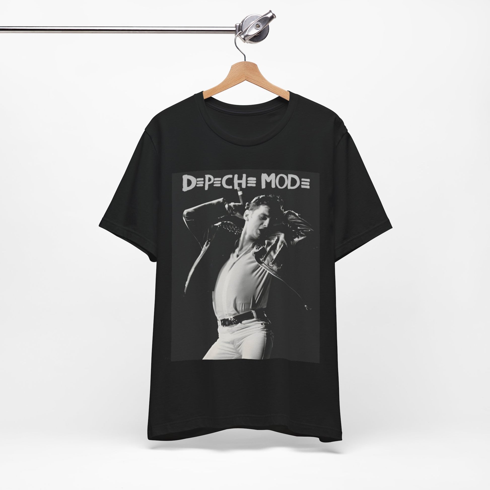 A black graphic t-shirt featuring a black and white graphic or photo of Depeche Mode performing live on stage.