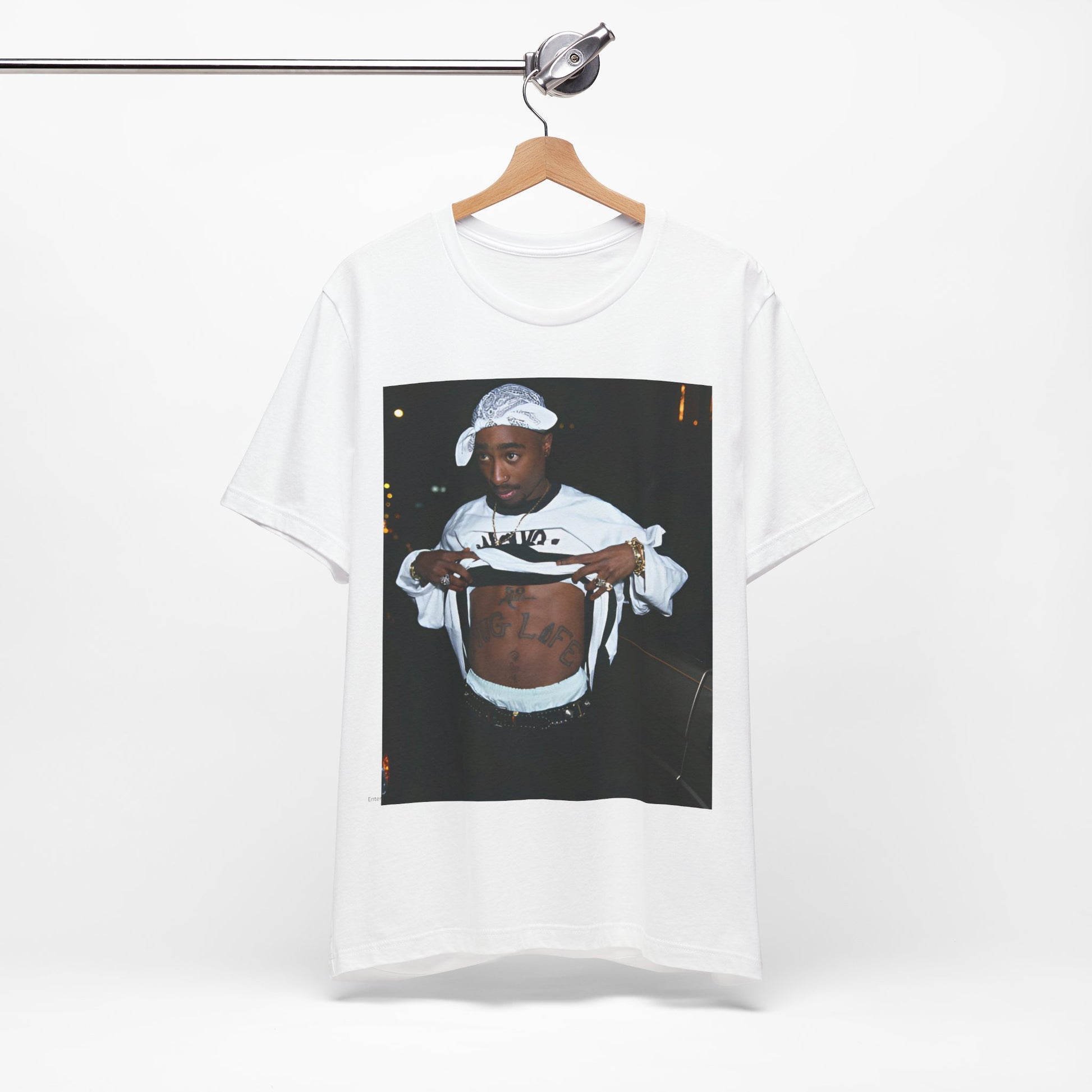 A black graphic t-shirt featuring a graphic of Tupac Shakur (2Pac).
